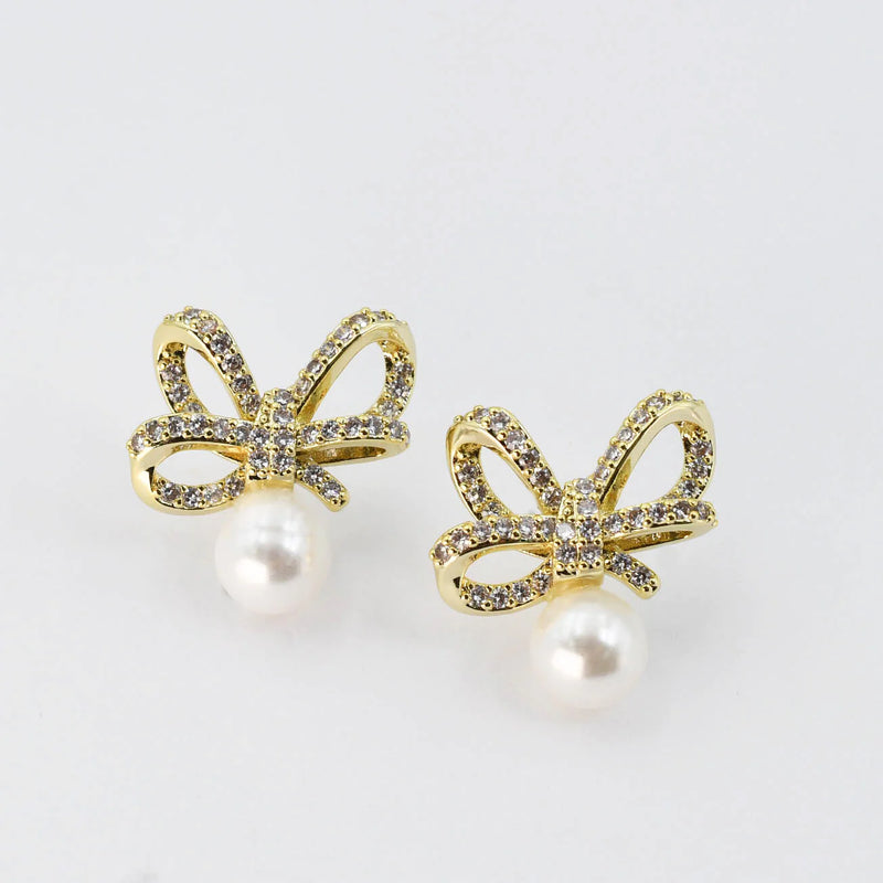 CRYSTAL RIBBON PEARL EARRINGS IN GOLD