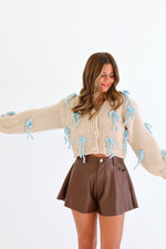 CHUNK BOW SWEATER IN SAND/BLUE