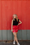 FAUX LEATHER BELTED SKIRT IN RED